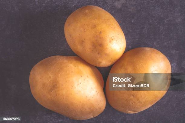 Potato Stock Photo - Download Image Now - Agriculture, Backgrounds, Black Background