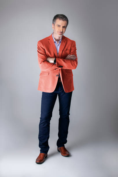 istock Stylish Middle-aged Model Wearing Coral Color Jacket 1161671164