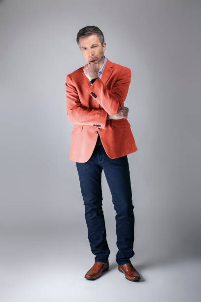 istock Stylish Middle-aged Model Wearing Coral Color Jacket 1161671182