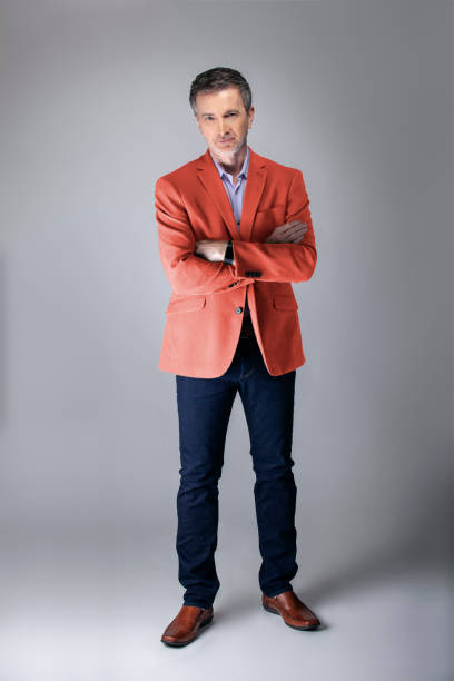 istock Stylish Middle-aged Model Wearing Coral Color Jacket 1161671189