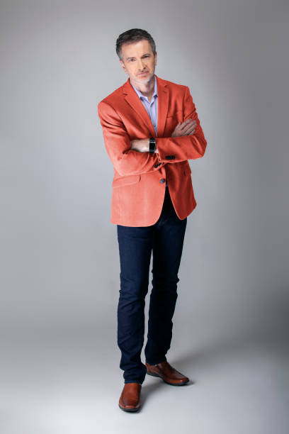 istock Stylish Middle-aged Model Wearing Coral Color Jacket 1161671193
