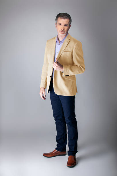 istock Posh Middle Aged Man Wearing Beige Jacket 1161671196