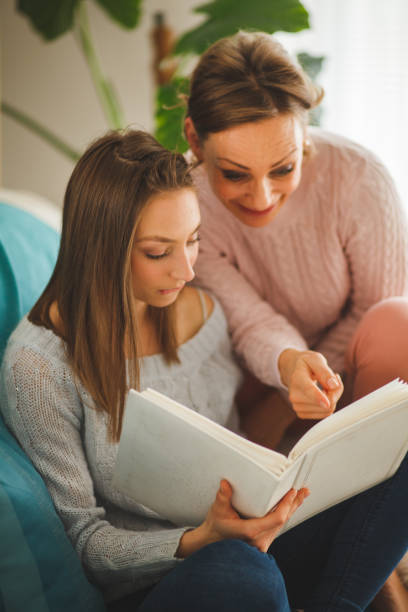istock Mother and daughter going down memory lane 1161673920
