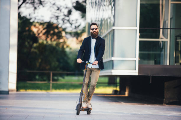 istock Hipster businessman taking an electric scooter to work 1161674564