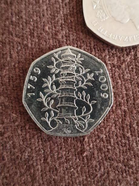 Kew Gardens 50p UK coinage circulated Rare 50p minted in 2009 celebrating 250 years of Kew Gardens. Only 210k of these coins were minted and so this is one of the rarest uk coins currently in circulation. kew gardens stock pictures, royalty-free photos & images