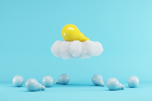 Yellow Lightbulb floating with cloud above blue lightbulbs on blue background. minimal creative idea concept. 3D render.