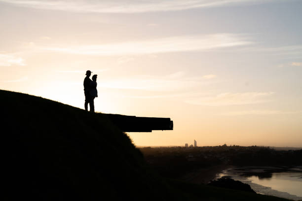 istock Happy couple hug at sunset 1161693356