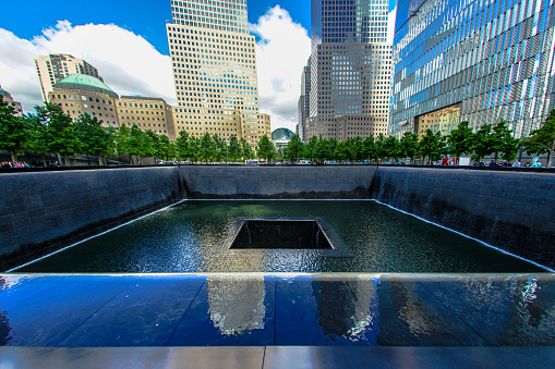 World Trade Center 9/11 memorial in New York City. Photographed on a clear sky summer day on 5/27/23