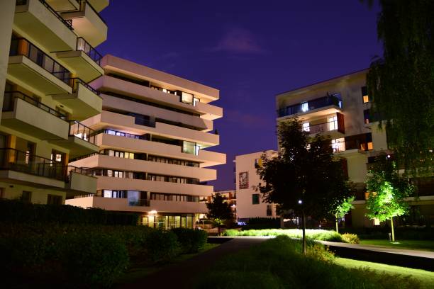istock Exterior of apartment building at night 1161701150