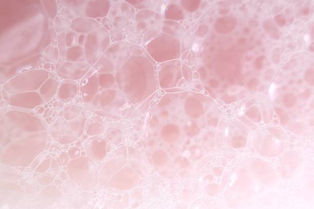 istock pink soap foam macro background.soap bubbles gently pink color with a white gradient. Bath foam. Ease.Lightness and airiness 1161701356