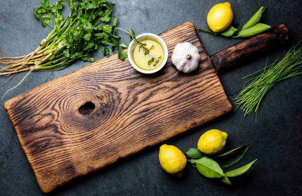 istock Herbs and spices around wooden cutting board. Top view with copy space 1161702149