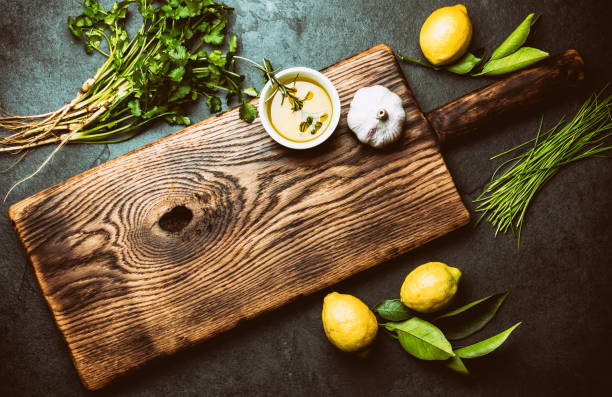 istock Herbs and spices around wooden cutting board. Top view with copy space 1161702152