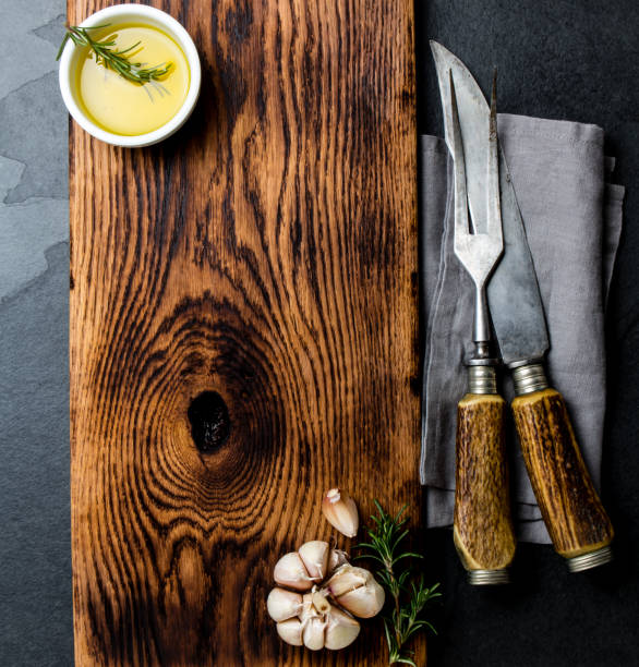 istock Cooking background concept. Vintage cutting board with cutlery. Top view 1161702479