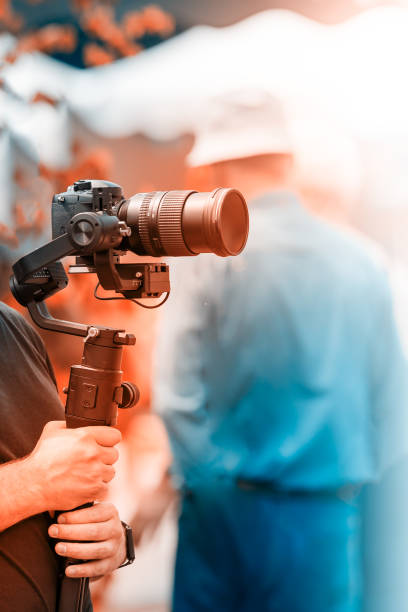 istock Video shooting with a camera with a tripod with a black stabilizer 1161708516