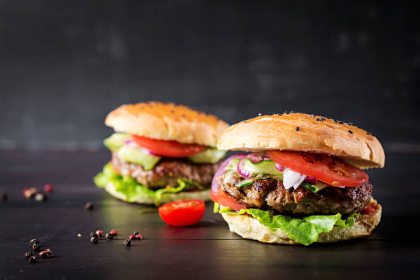 istock Big sandwich - hamburger burger with beef,  tomato,  red onion and lettuce. 1161711202