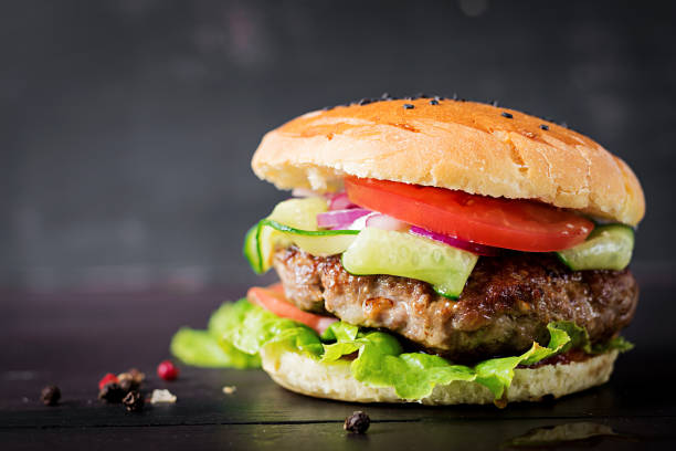 istock Big sandwich - hamburger burger with beef,  tomato,  red onion and lettuce. 1161711212