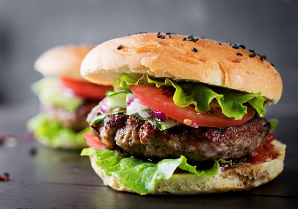 istock Big sandwich - hamburger burger with beef,  tomato,  red onion and lettuce. 1161711215