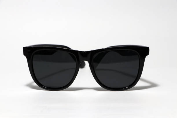 istock Black sunglasses on the white floor. 1161712361