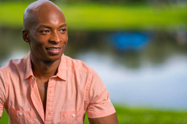 istock Portrait of a handsome young black man posing in a park setting 1161713417