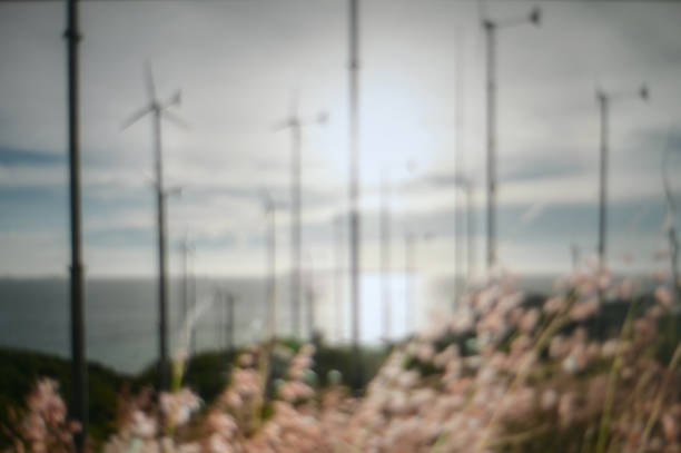 Abstract blurred defocused wind turbine nature background.