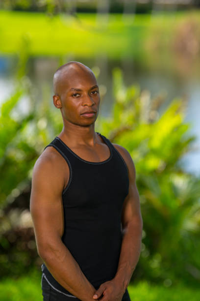 istock Man posing in a tank top. Image lit with off camera flash 1161716141