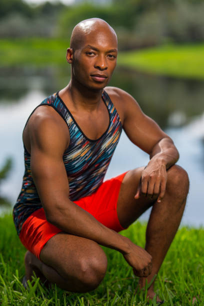 istock Portrait of a handsome young man in a squatting post 1161716313
