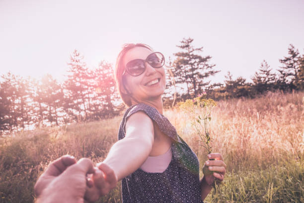 Photographer captures girlfriend leading him around the world.