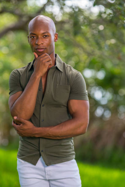 istock Portrait of a handsome black model posing with hand under chin 1161717208