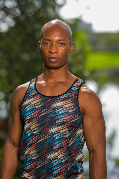 istock African American athletic man posing outdoors in a park setting 1161717277