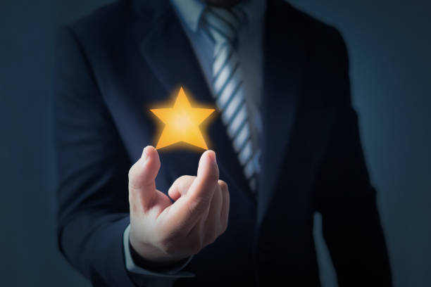 istock excellent service and best customer experience or good client , business man showing star rating or goal on dark blue background 1161718759
