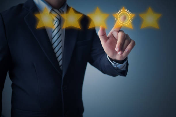 istock excellent service and best customer experience or good client , business man pointing at 5 stars rating on dark blue background 1161718760