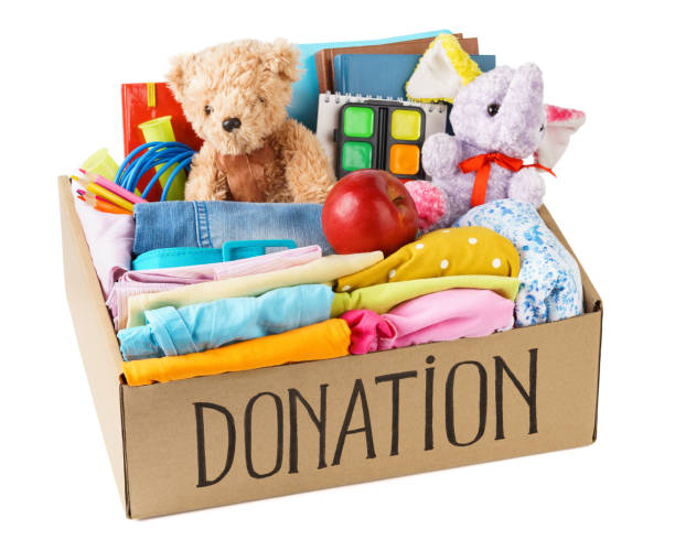 istock Different donations in a box - clothes, stationery and toys. 1161722707