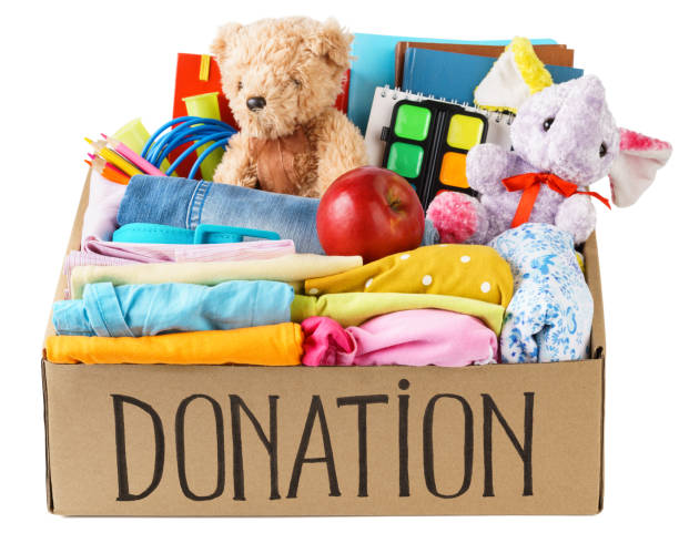 istock Different donations in a box - clothes, stationery and toys. 1161723414