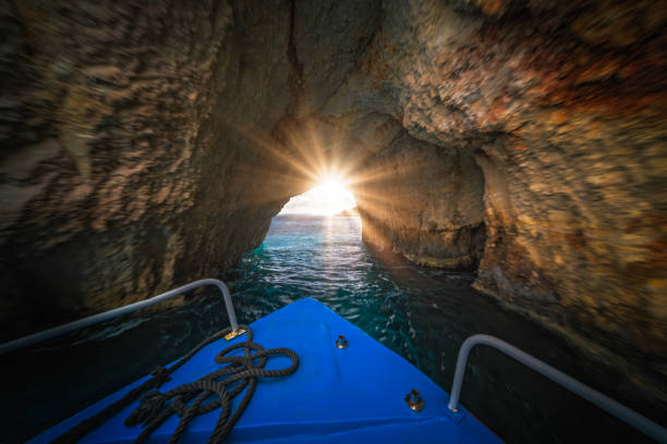 istock Tourist boat sailing inside the Blue Caves 1161725959