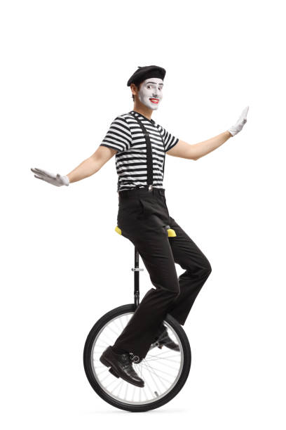 istock Mime riding a unicycle and making a grimace 1161728006
