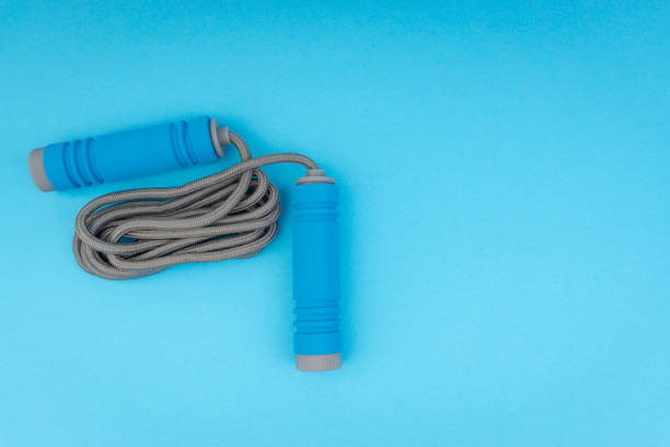 istock Skipping rope or jumping rope isolated on blue background 1161728085