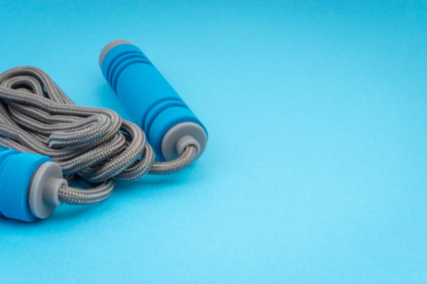 istock Skipping rope or jumping rope isolated on blue background 1161728134