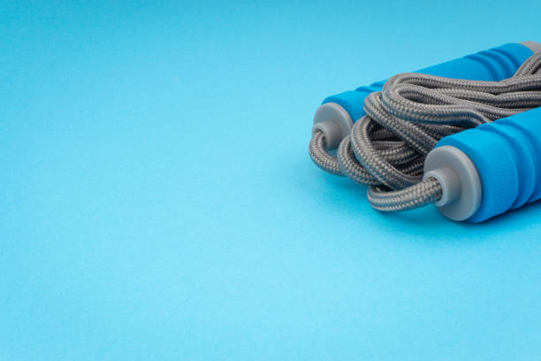 istock Skipping rope or jumping rope isolated on blue background 1161728136