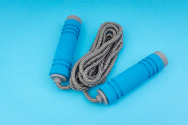 istock Skipping rope or jumping rope isolated on blue background 1161728143