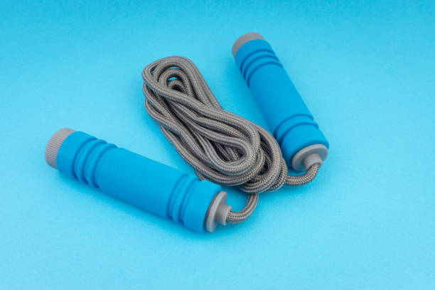 istock Skipping rope or jumping rope isolated on blue background 1161728206