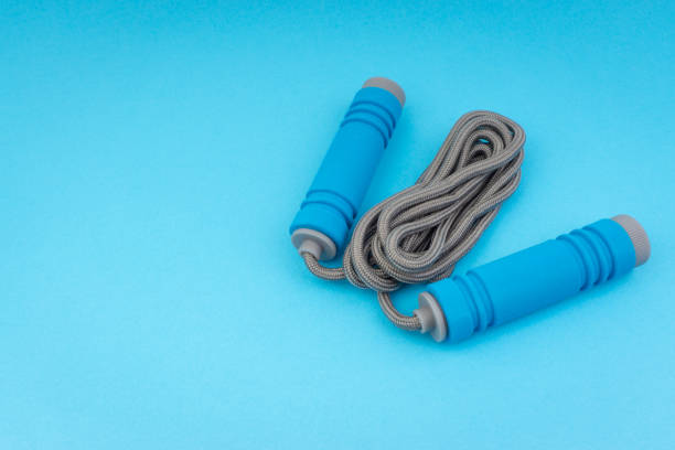 istock Skipping rope or jumping rope isolated on blue background 1161728209