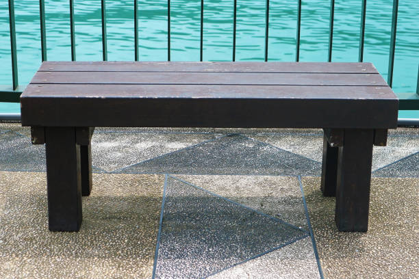 Old Outdoor Wooden Bench Isolated on the Pier