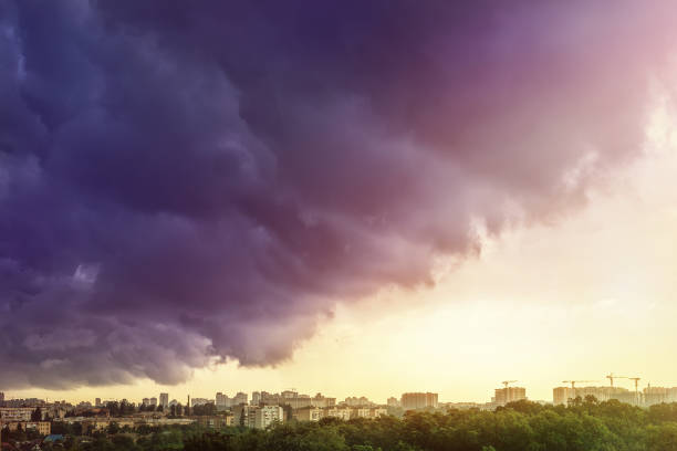 istock Cityscape covered with dramatic stormy dark clouds after heavy rain and thunderstorm. Natural disaster. Autumn seasonal weather forecast 1161730353