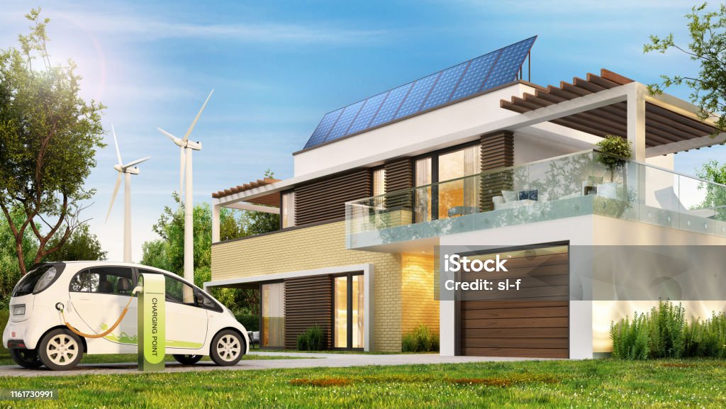 Modern eco house with solar panels and wind turbines and an electric car. Modern eco house with solar panels and wind turbines and an electric car. Solar panels on the roof of the house. House Stock Photo