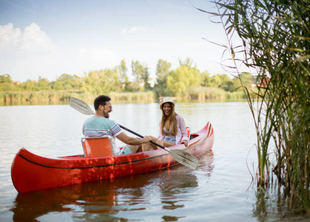 istock Loving couple rowing on the lake 1161732423
