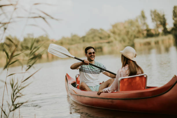 istock Loving couple rowing on the lake 1161732439