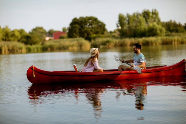 istock Loving couple rowing on the lake 1161732443