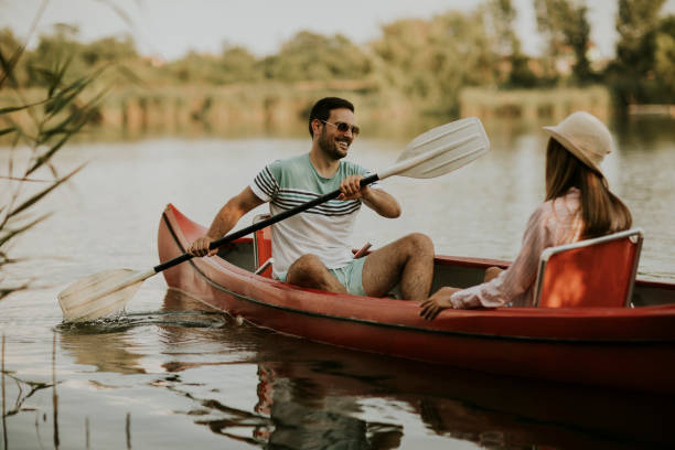 istock Loving couple rowing on the lake 1161732448