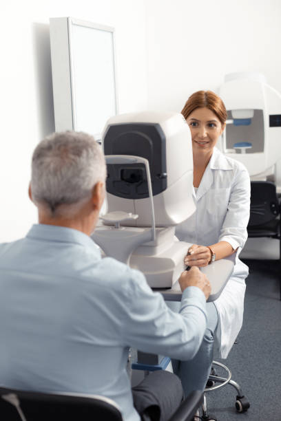 istock Grey-haired retired man feeling worried while visiting eye doctor 1161733457