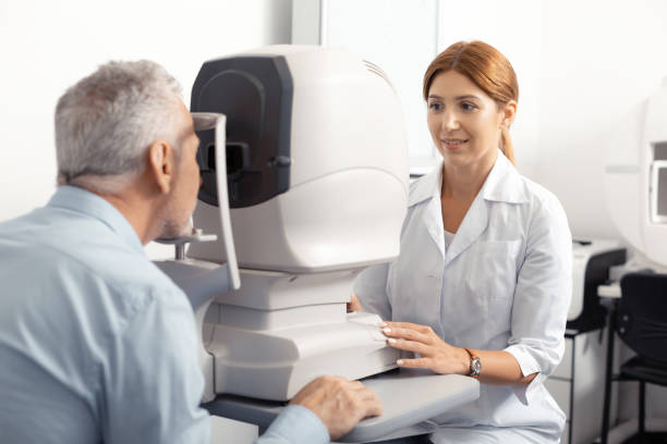 istock Grey-haired retired man having eye doctor consultation 1161733461